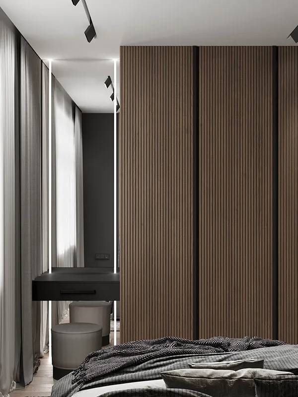 胡桃木色墙板与触感舒适的黑色肤感面板搭配设计,冷暖结合赋予了空间
