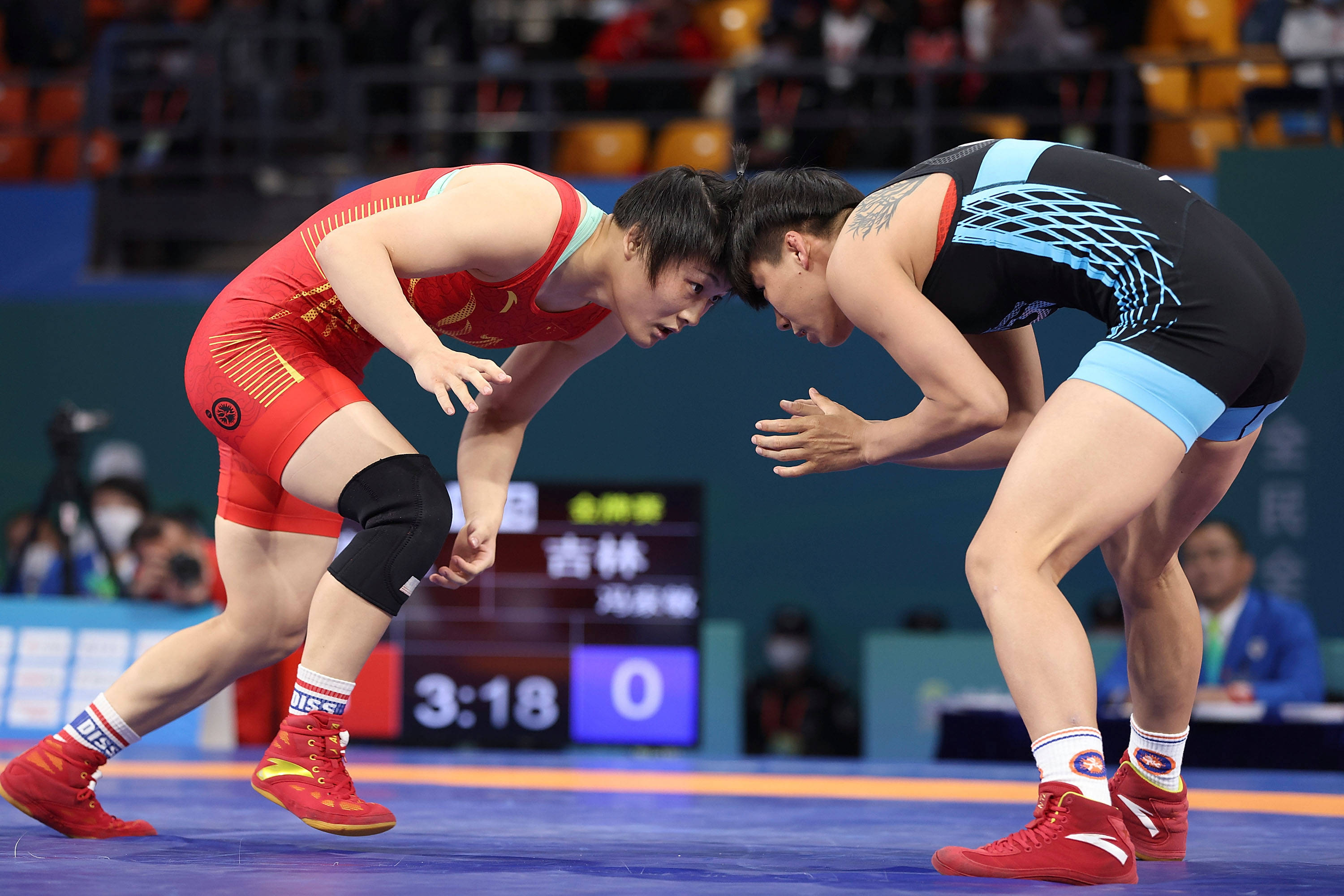 在陕西延安进行的第十四届全运会摔跤项目女子自由式57公斤级决赛中