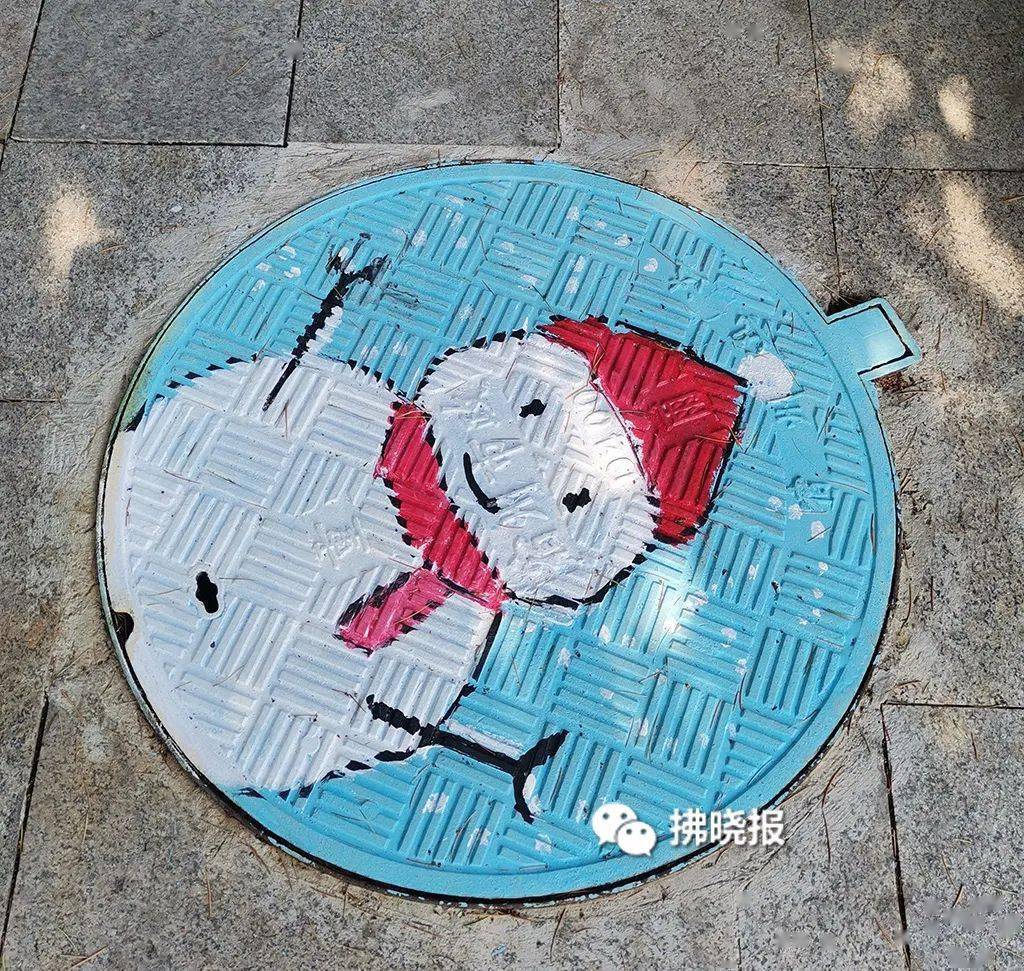 漂亮创意彩绘让井盖变成景盖