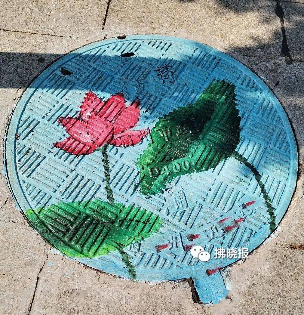 锈迹斑斑的井盖都"不见"了,都被涂鸦成了五颜六色的画作