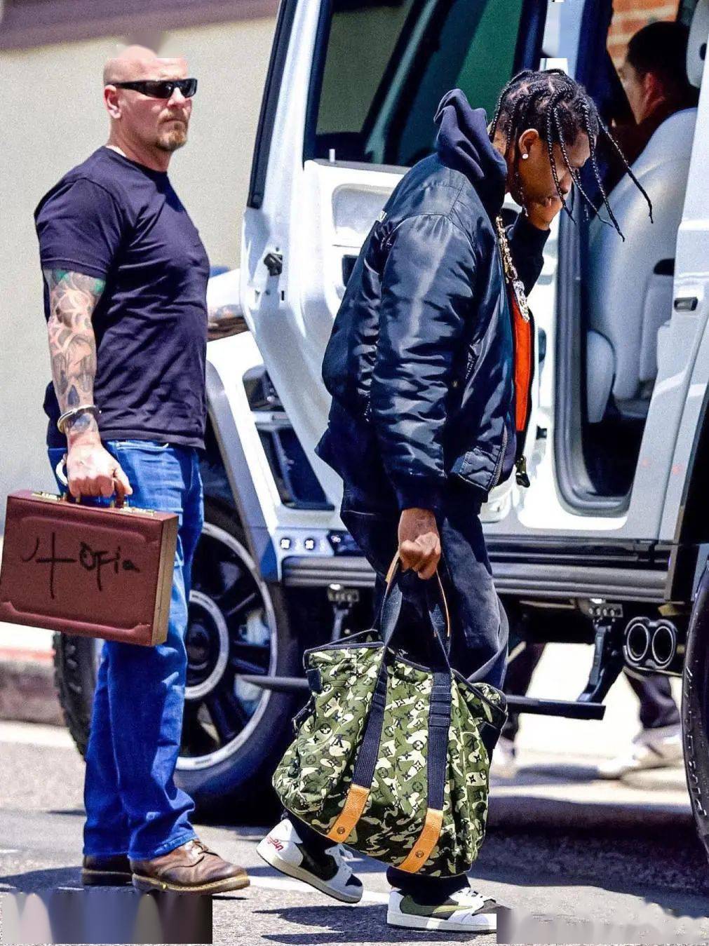SPOTTED: Travis Scott Carries LV Briefcase while in Supreme