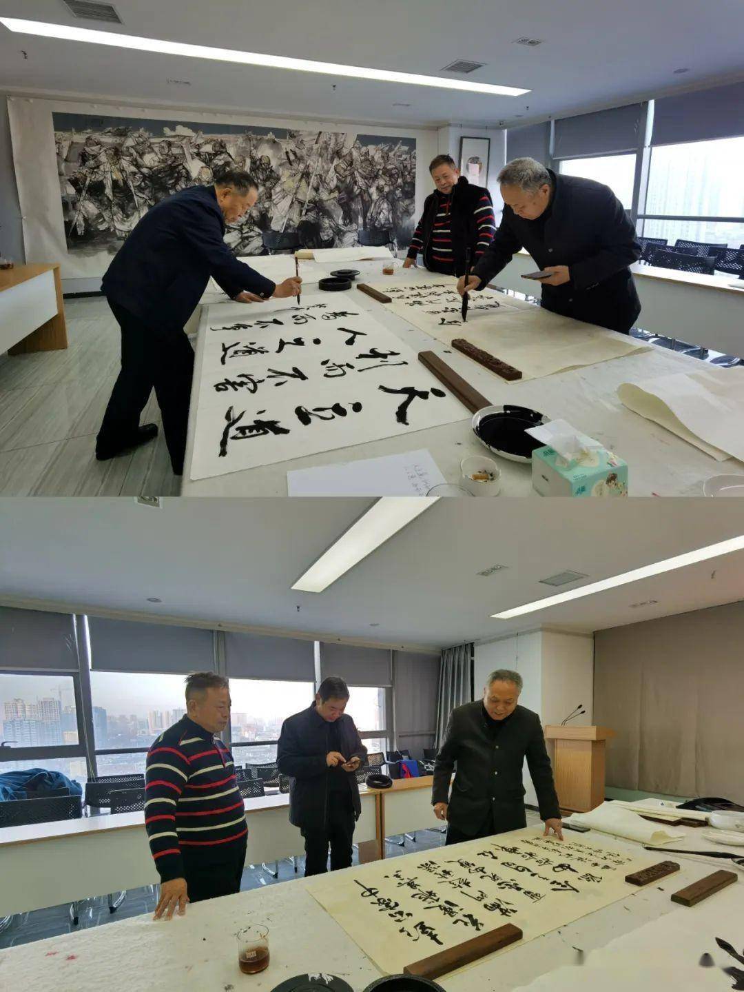 活动现场,海军大校张德玉艺术家,中国书法家协会会员彭新春大家展纸